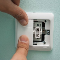 How to disassemble a light switch for repair or replacement