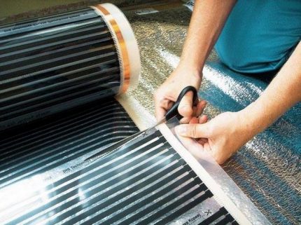 Cutting infrared warm floor into strips for laying under linoleum