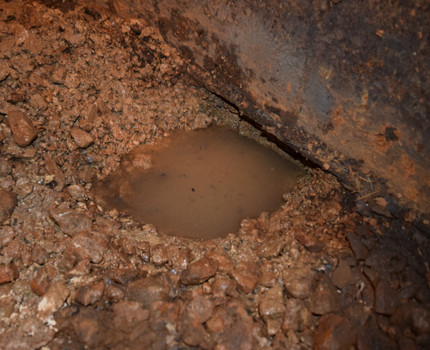 Puddle at the base of the foundation