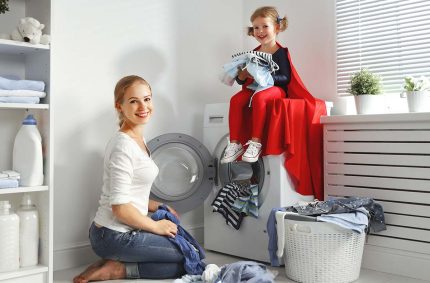 Mom, baby and washing machine