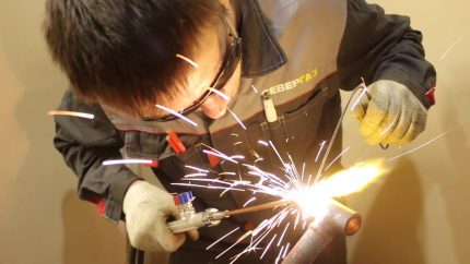 Welder processes a gas pipe