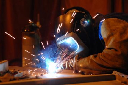 Welder conducts hot work