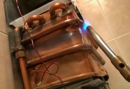 Soldering a copper heat exchanger of a gas boiler