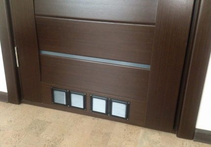 Doors with ventilation grilles