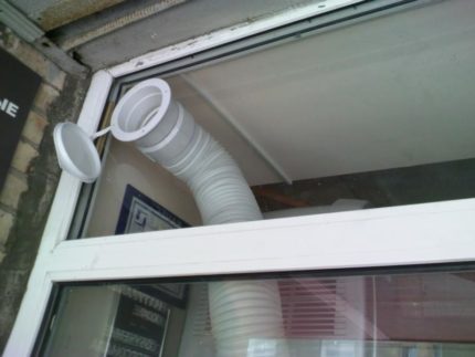 Pre-designed hole in a plastic window