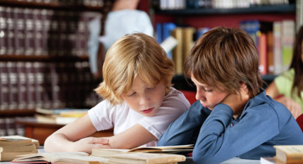 Children are reading a book